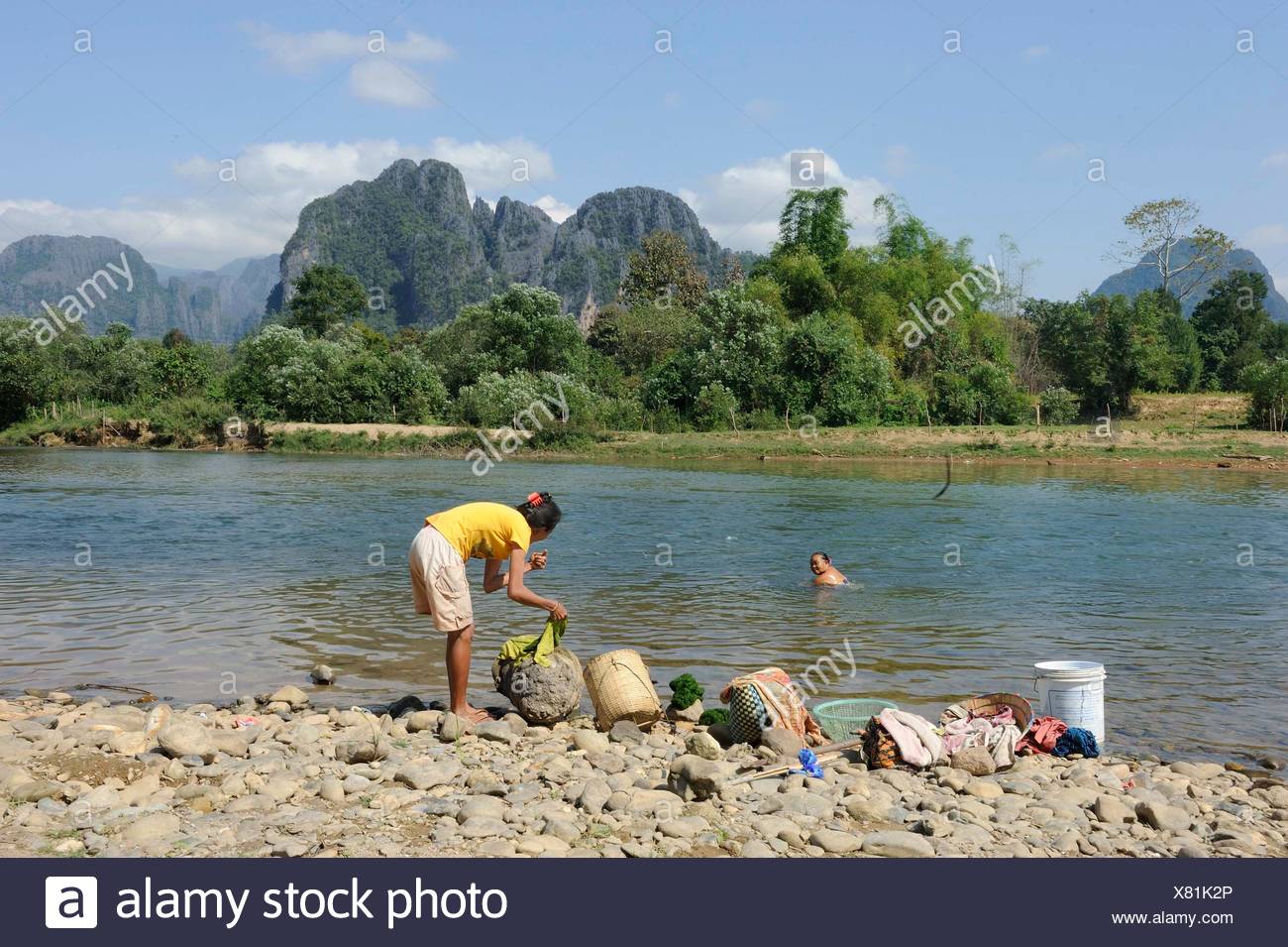 Washing Clothes With River Water Stock Photos Washing Clothes