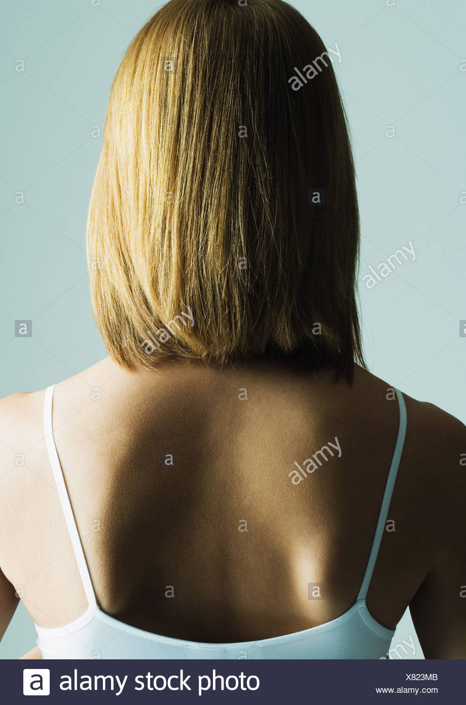 Young Woman With Shoulder Length Hair Rear View Stock Photo