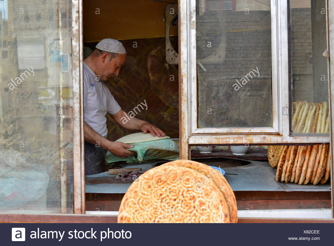 Flatbread Baker In A Bakery Uyghur Muslim Quarter Kashgar