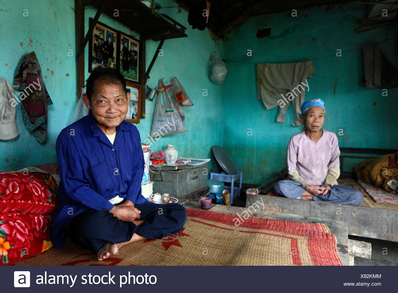 Quack Thi Thih, 71, and her husband, Quack Van Thui, 81, in their home almost completly destroyed by a flood, Lien Hoa, Hoa Bin Stock Photo