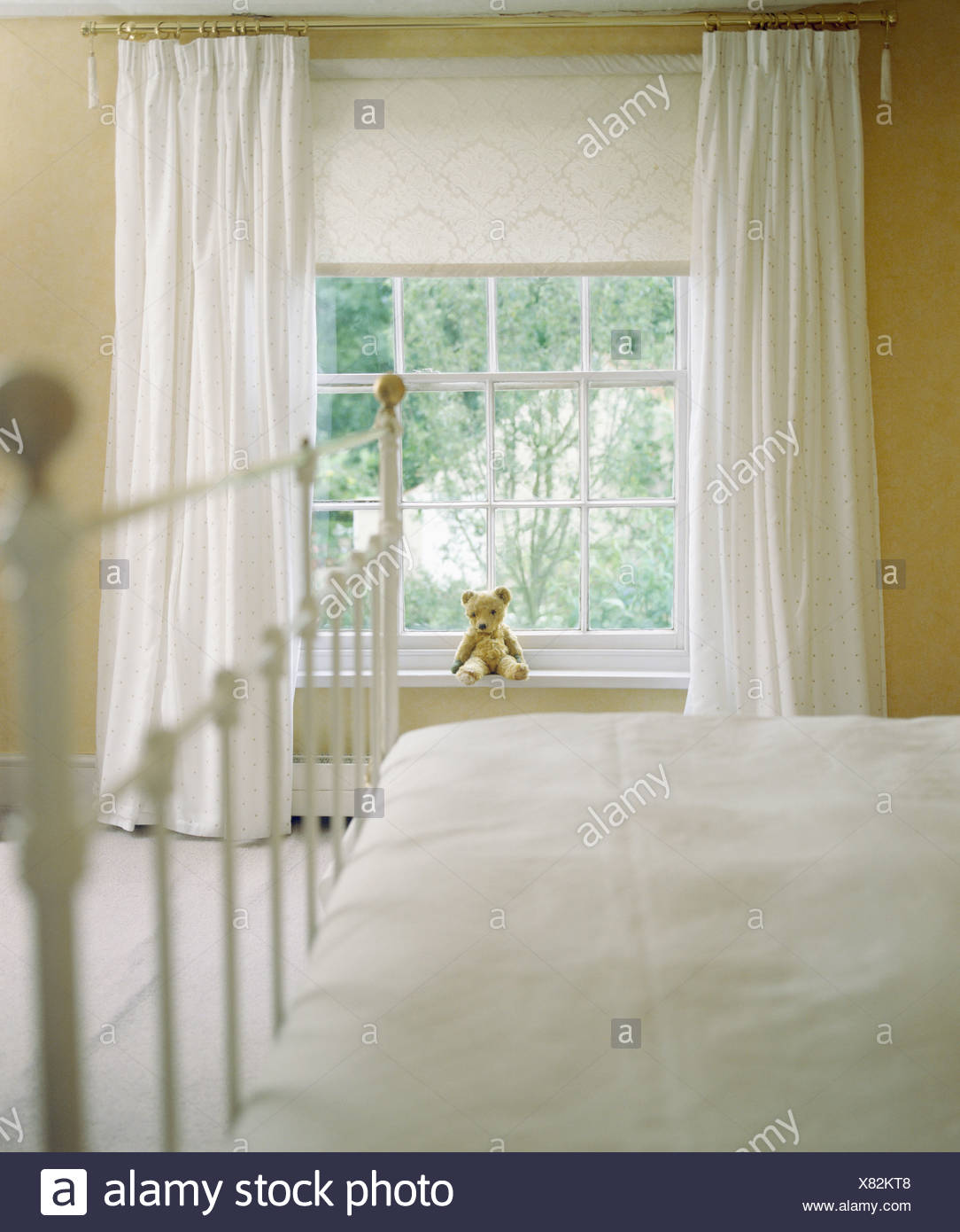 White Curtains And Cream Blind On Window In Cream Country Bedroom Stock Photo Alamy