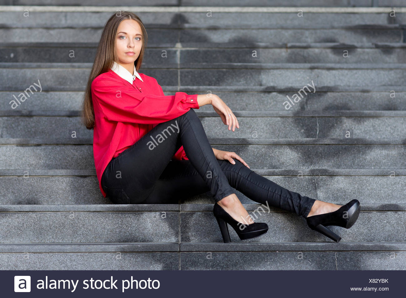 red top with black jeans