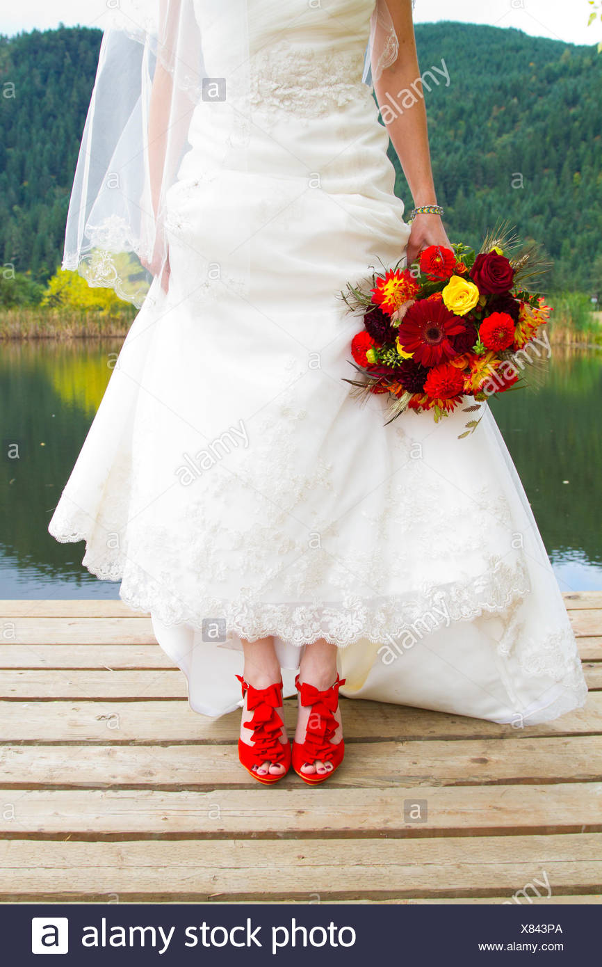 Bride and Red Shoes Stock Photo - Alamy