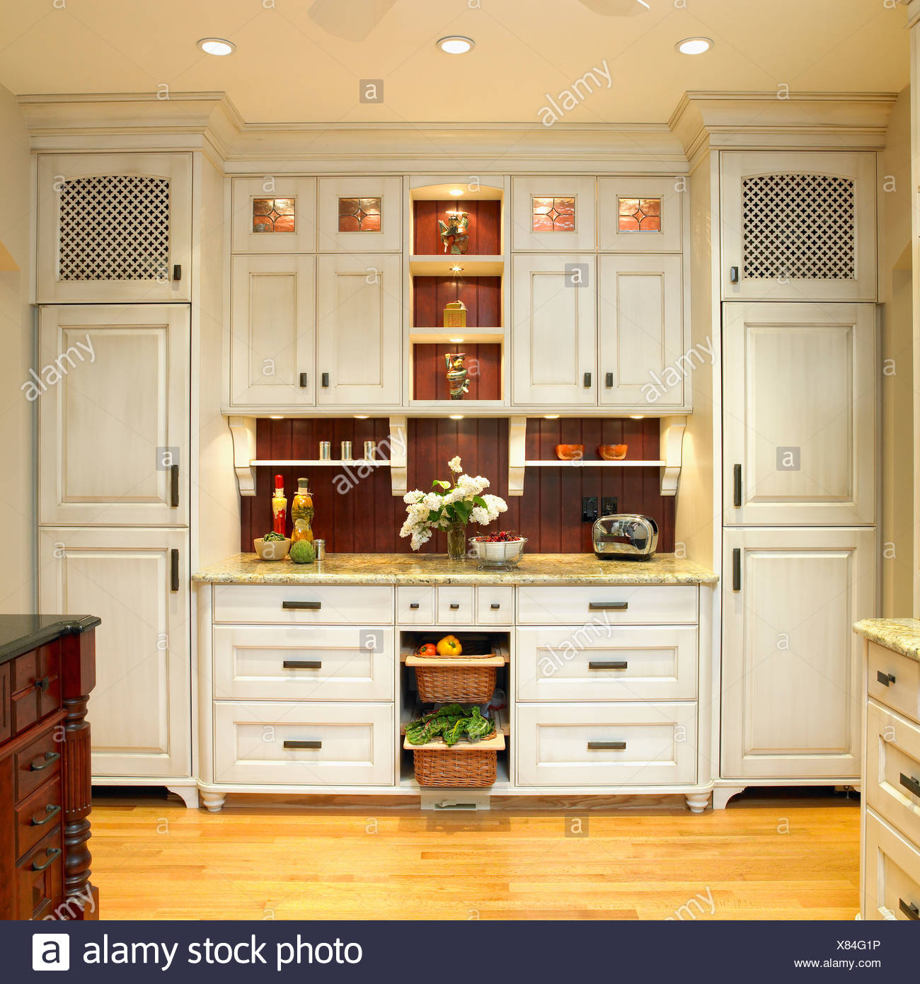 Traditional Built In Kitchen Cabinetry With Cream Finish And Dark