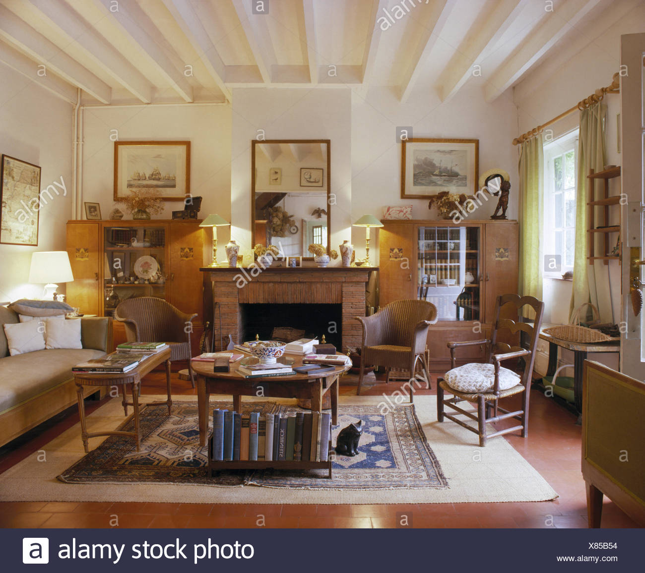 Lloyd Loom Chairs And Comfortable Sofa In French Country Living