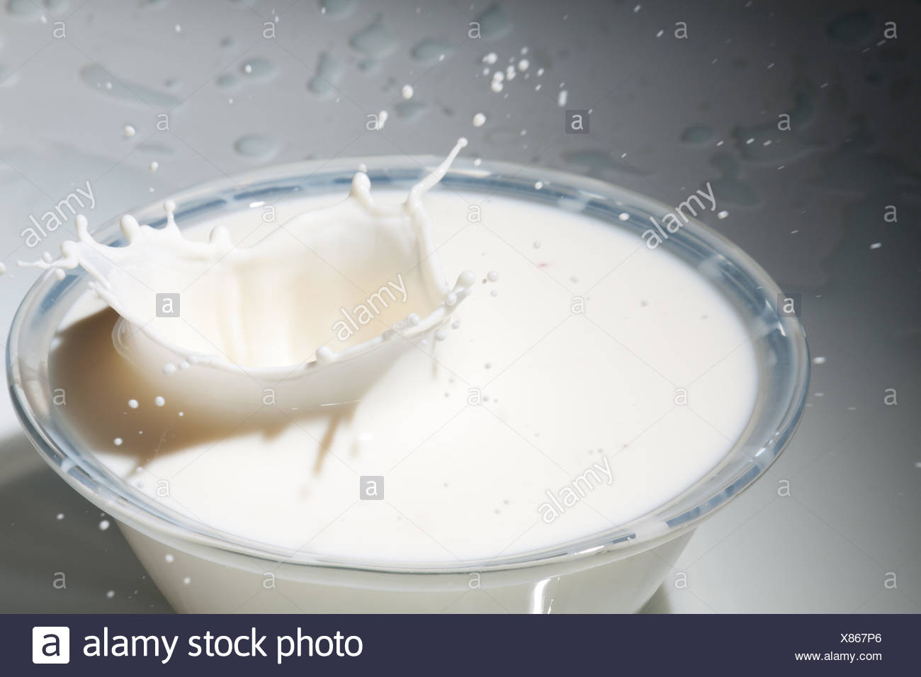 Milk Splashing In A Bowl Stock Photo Alamy