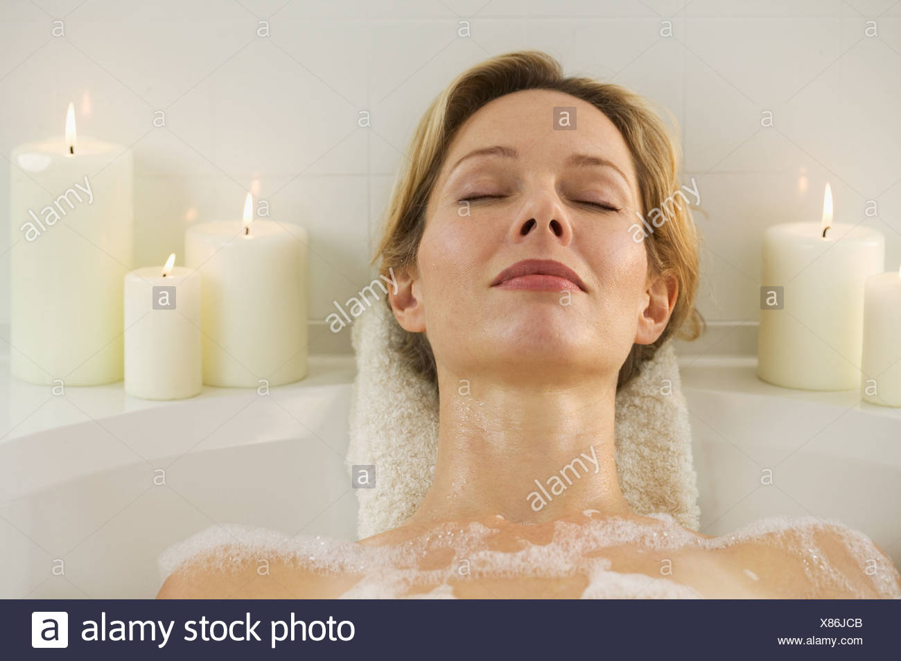 One Woman Relaxing Bath Candles High Resolution Stock Photography and