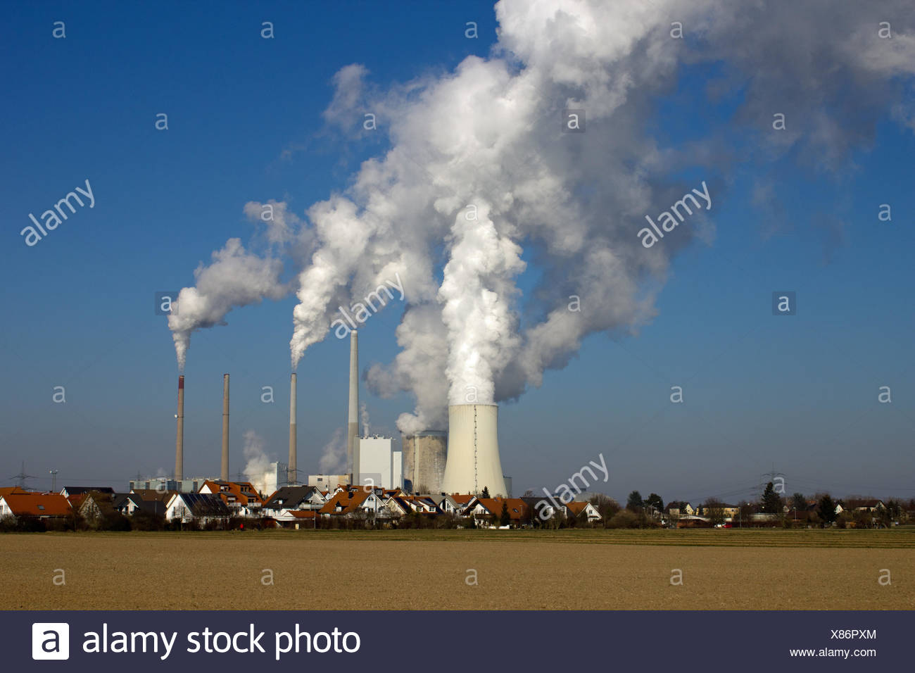 nuclear power plant and residential area Stock Photo