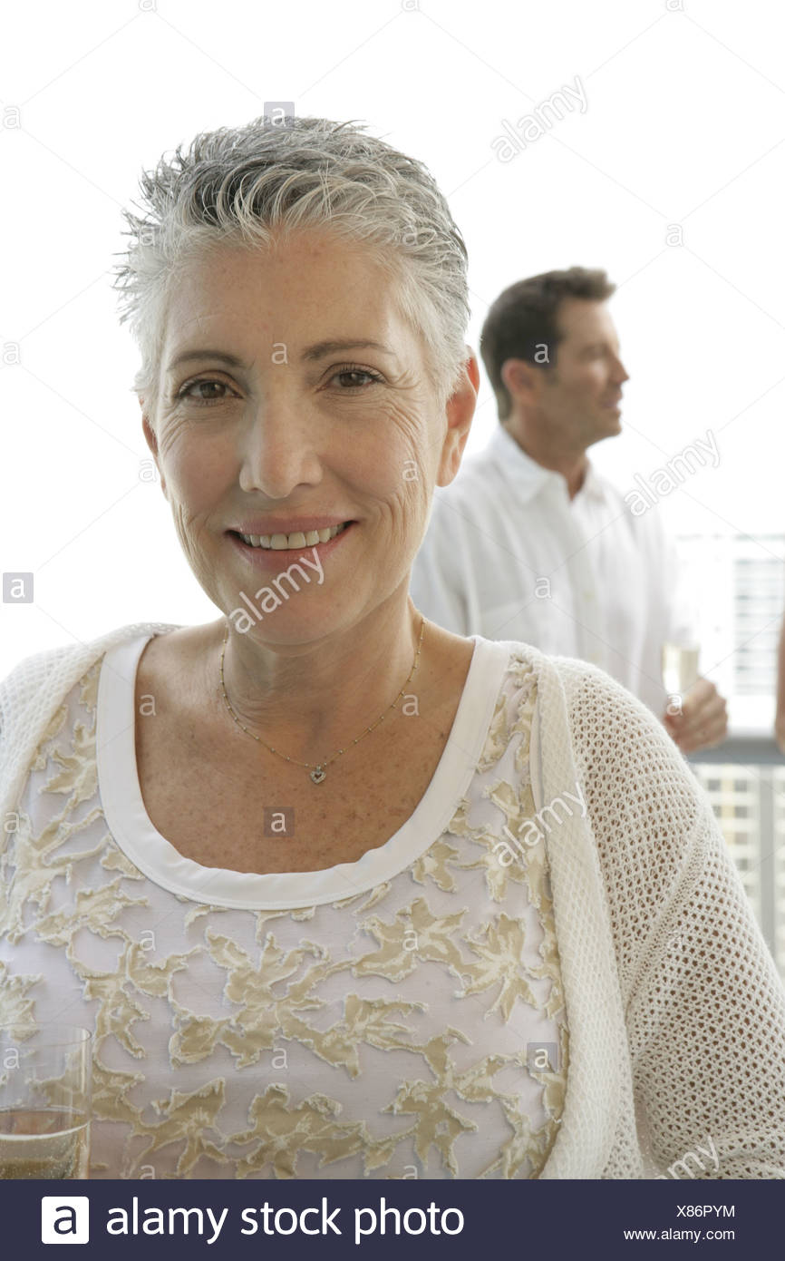 Mature Woman With A Short Hair Cut Looking At Camera Stock Photo