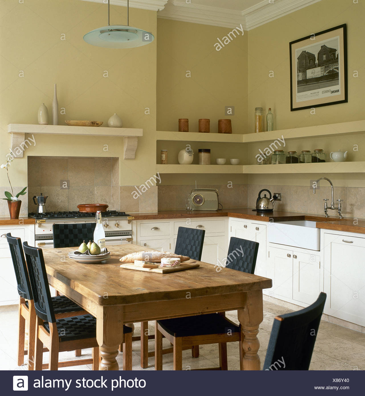 Pine Table And Chairs With Black Seats And Backs In Cream