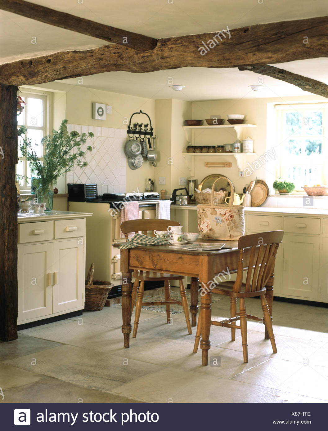 Vintage Pine Dining Table And Chairs In A Cream Cottage Kitchen