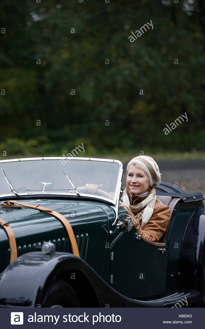 Senior Woman Driving Antique Car Stock Photo Alamy