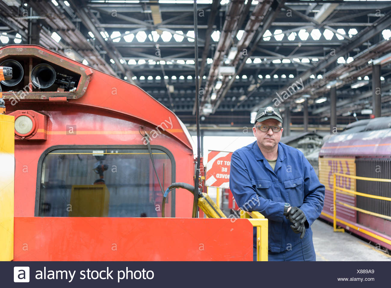 Portrait of locomotive engineer working in train works Stock Photo