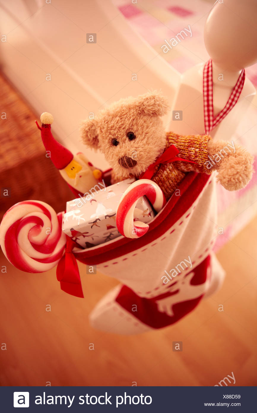 Close up of Christmas stocking hanging from bed Stock Image
