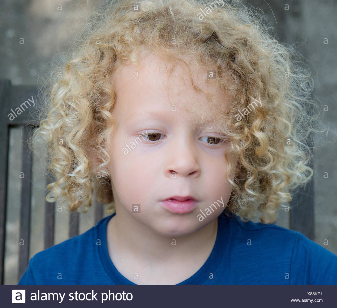 Portrait Of A Little Boy With Blond Curly Hair Stock Photo Alamy