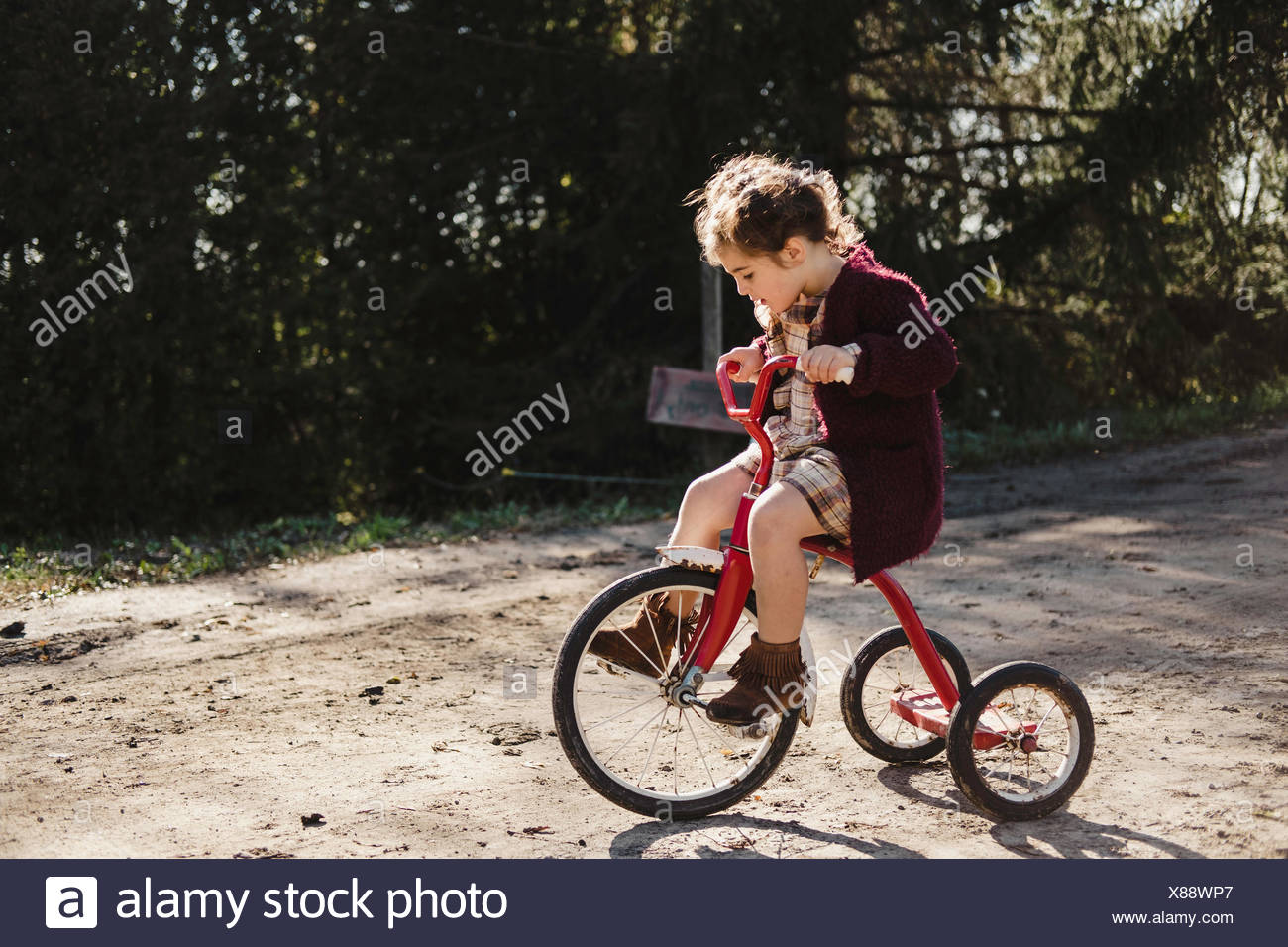 girl on tricycle