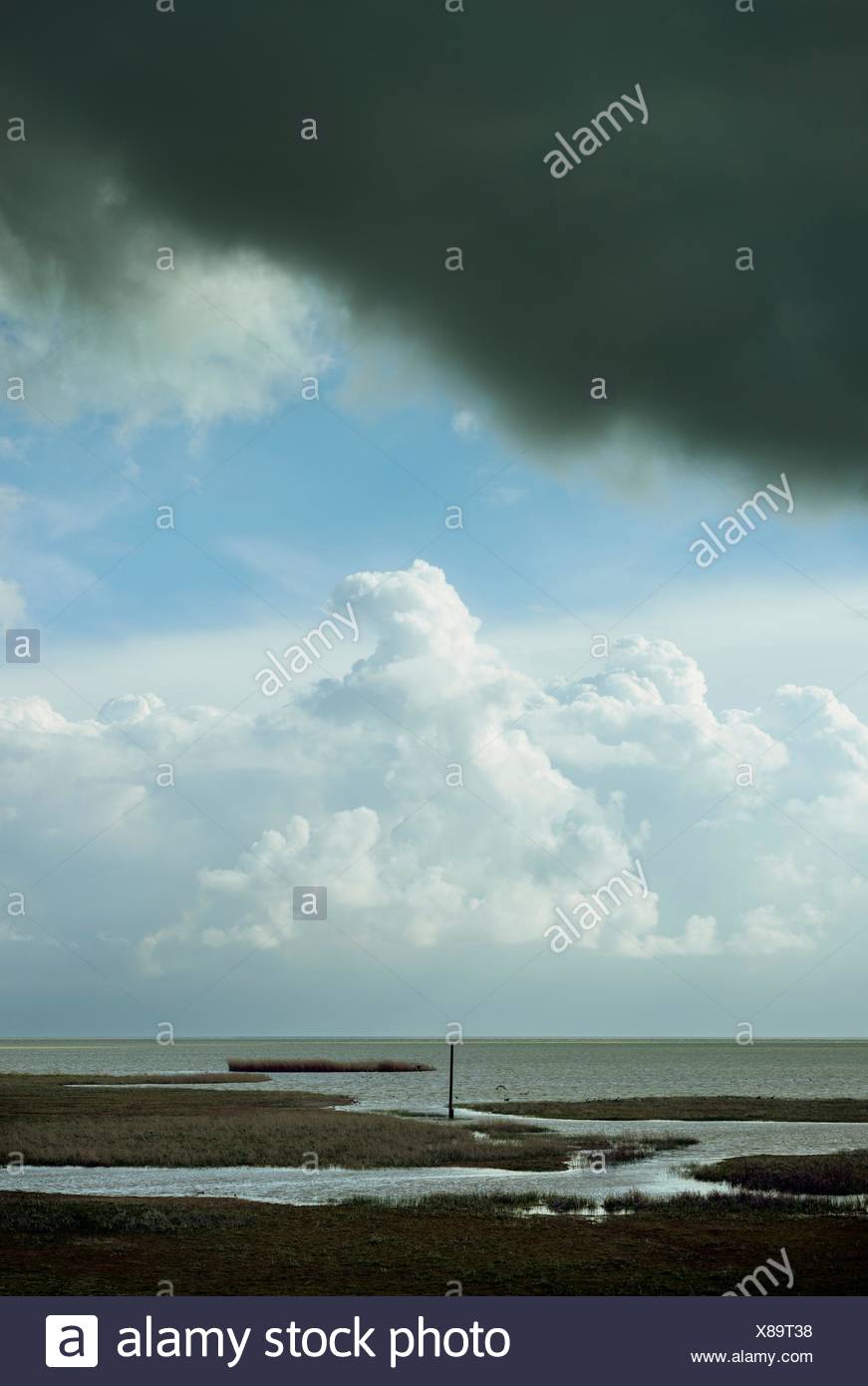 View of IJsselmeer lake and approaching storm clouds, Workum ...