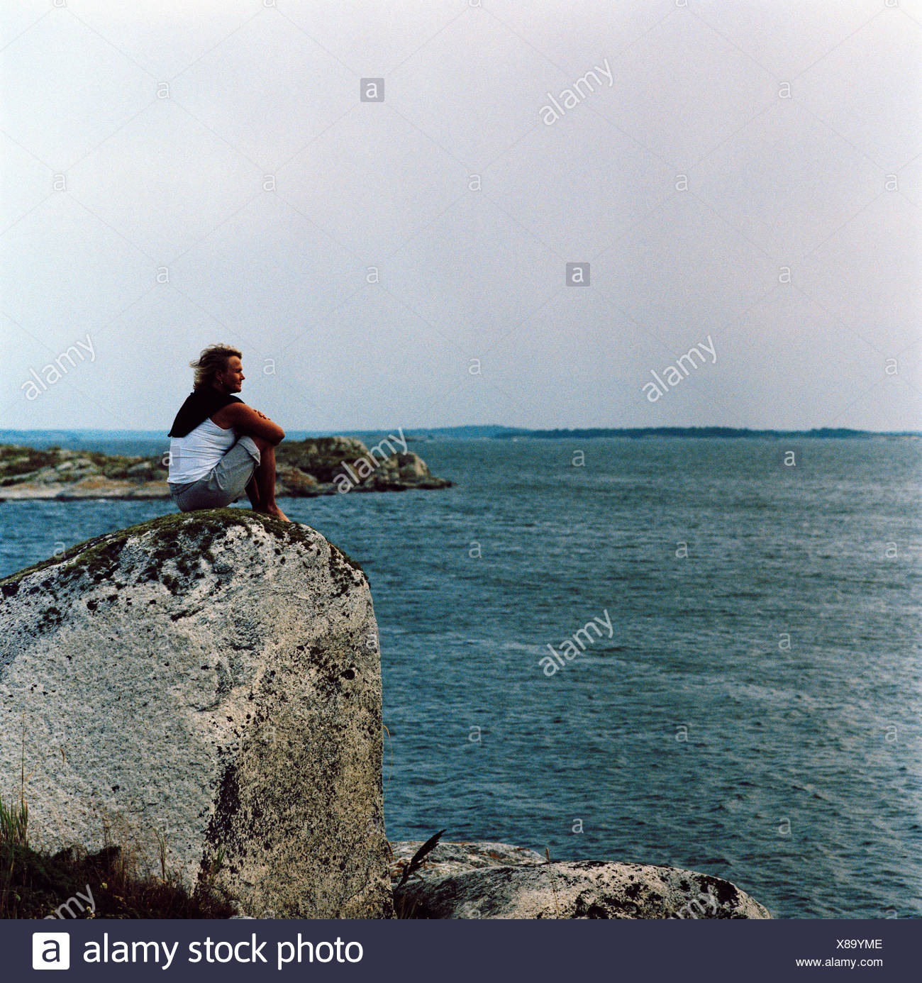 sitting on a cliff