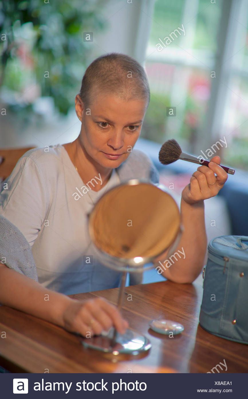 Woman 48 Years Old With Short Hair After Chemotherapy Applying