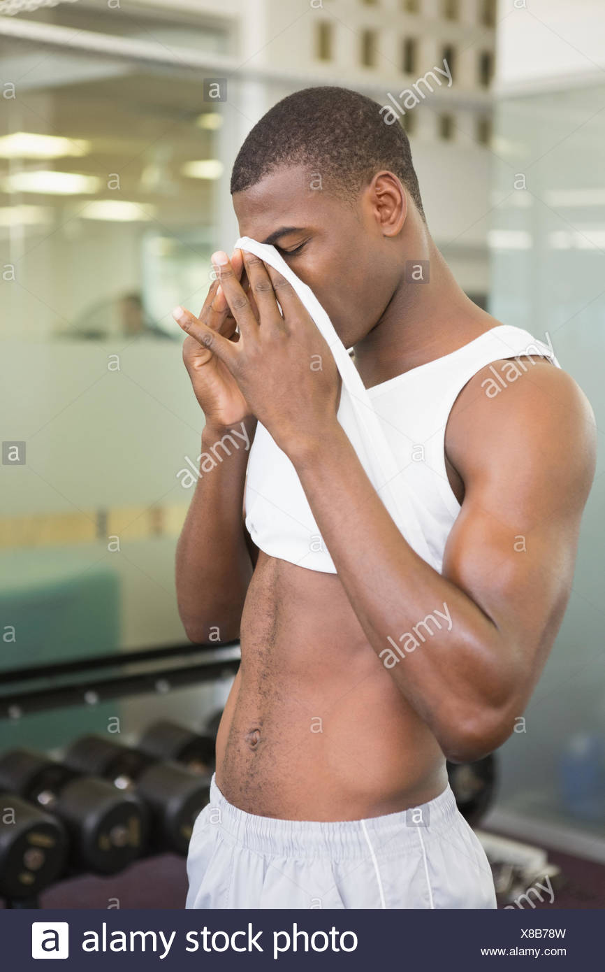 Fit man wiping sweat after workout in gym Stock Photo: 280530345 ...