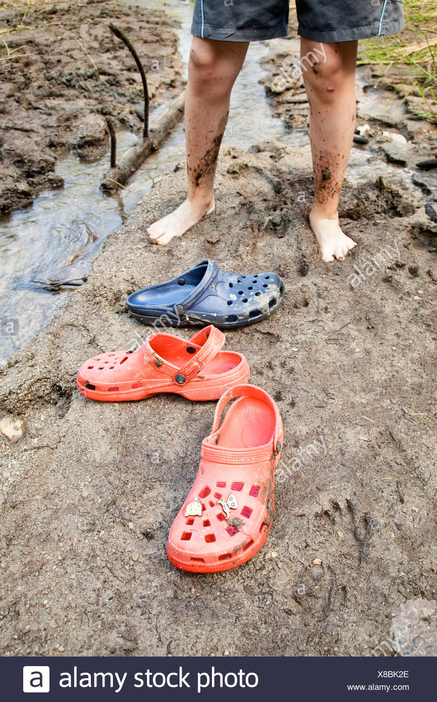 blue and yellow mismatched crocs