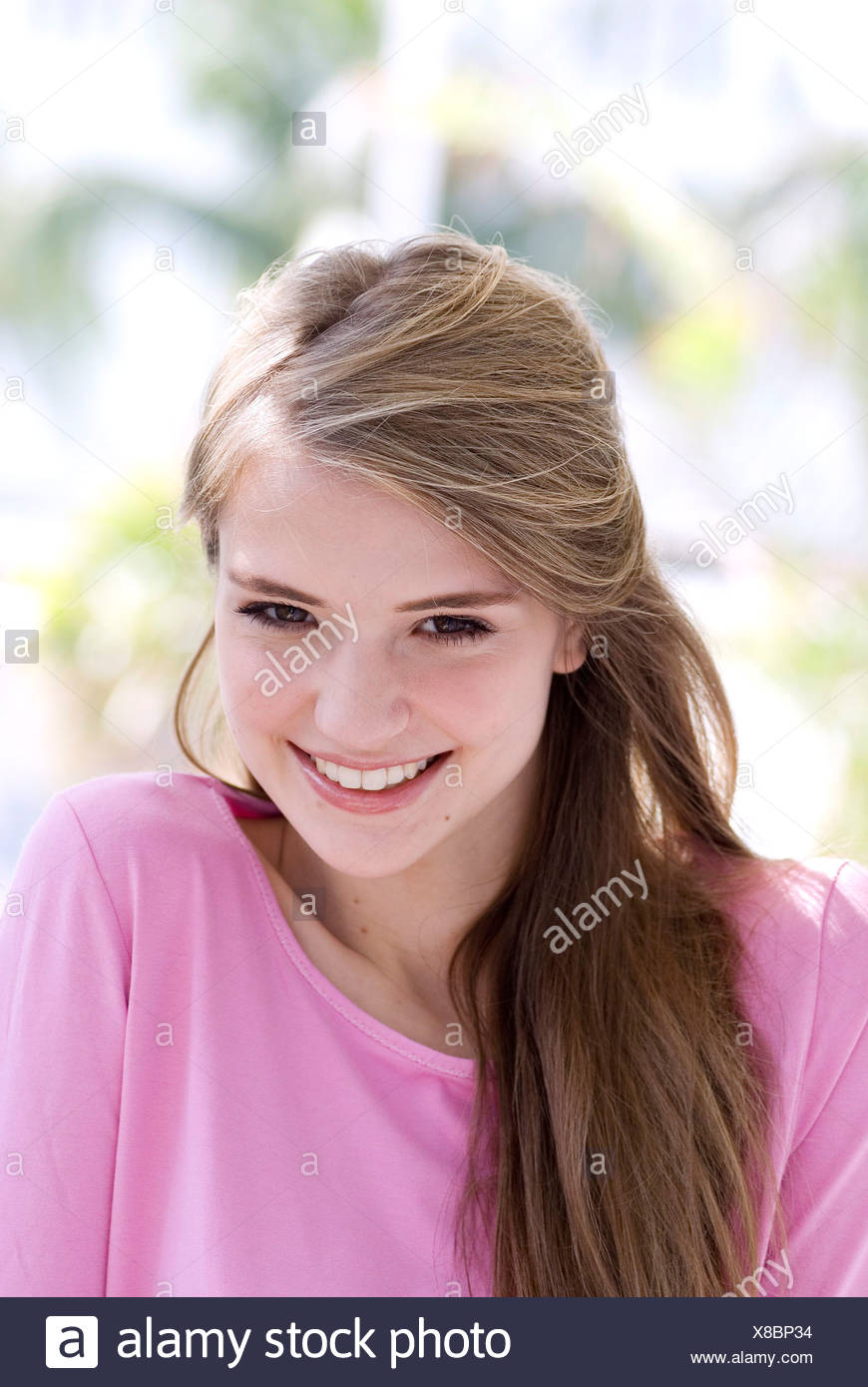 Female Long Straight Light Brown Hair Wearing Pink Round Neck