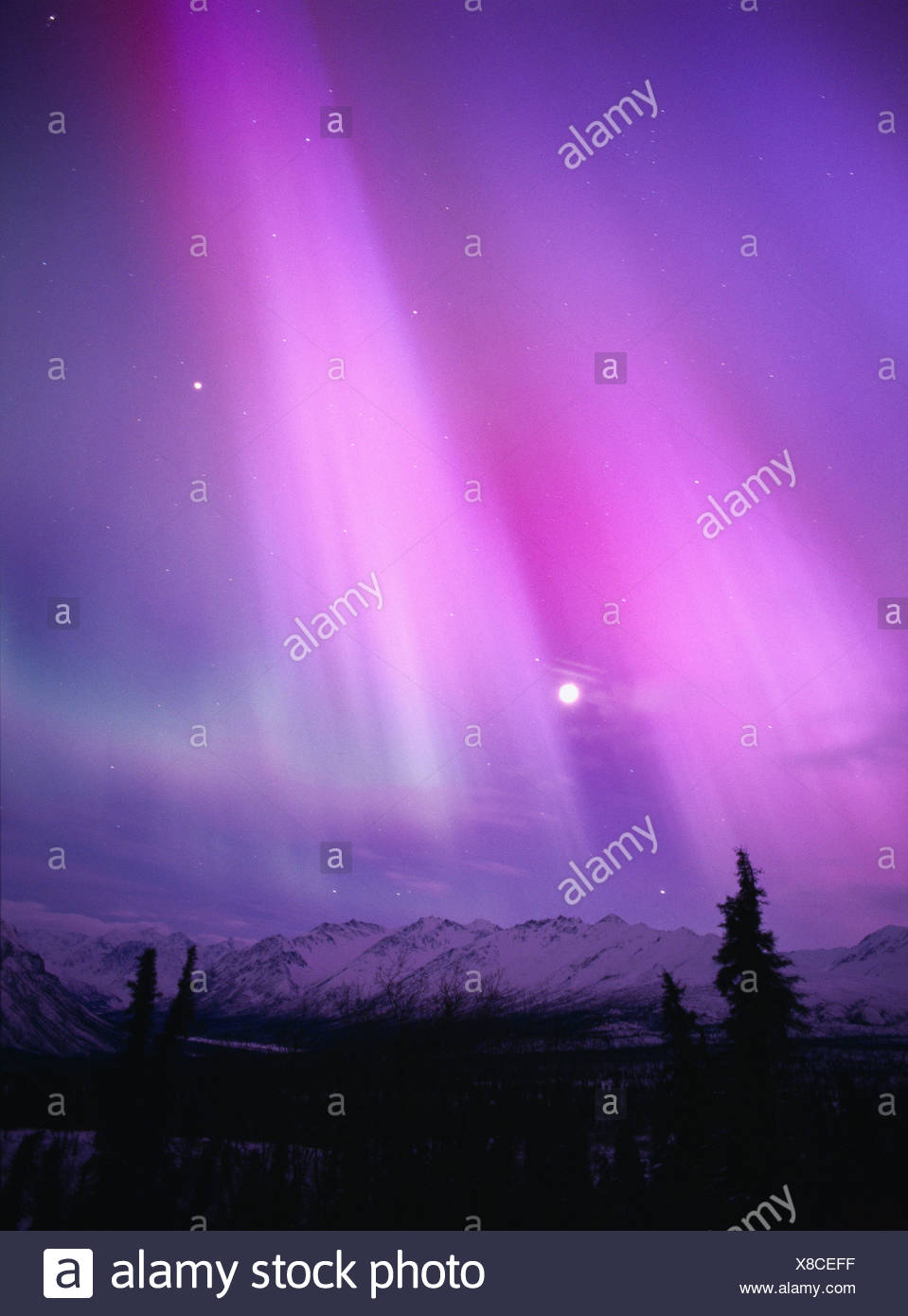 Pink Purple And Green Northern Lights With Moon Majestic Valley Alaska Stock Photo Alamy