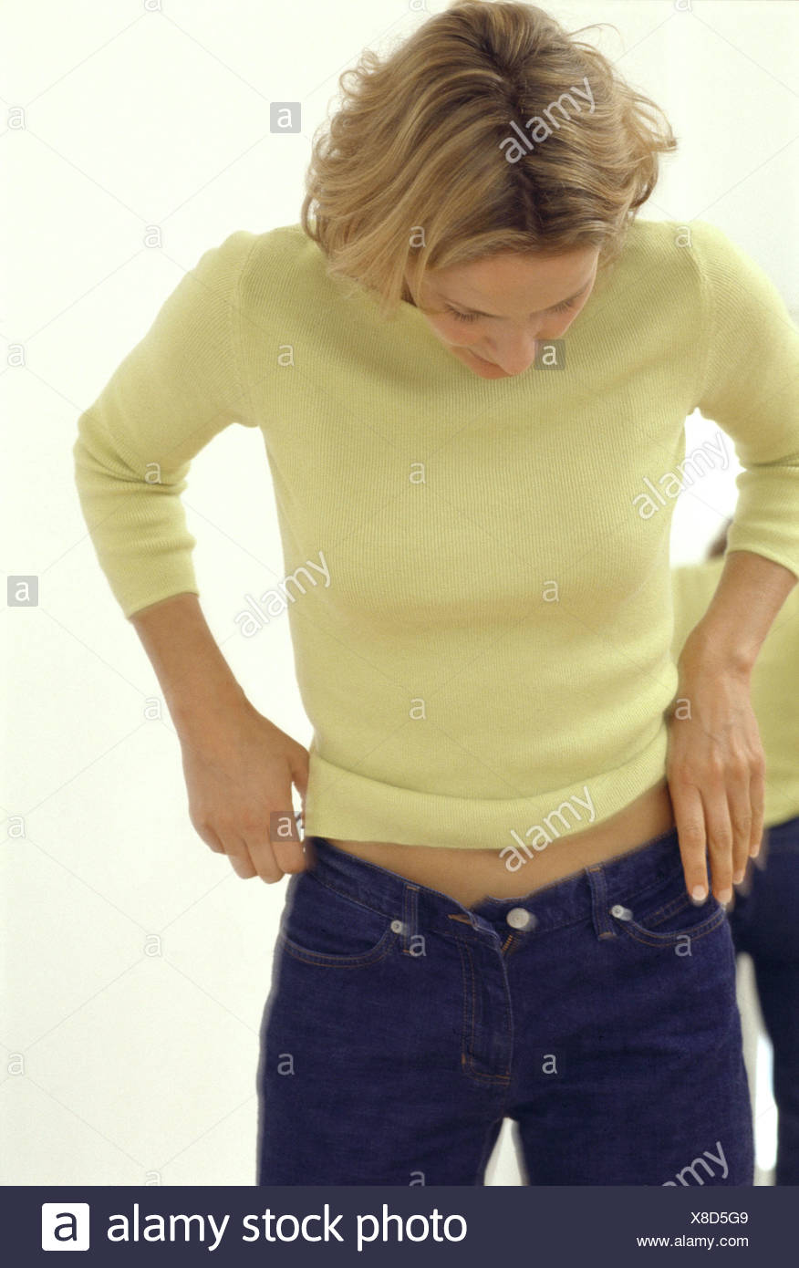 yellow jumper blue jeans