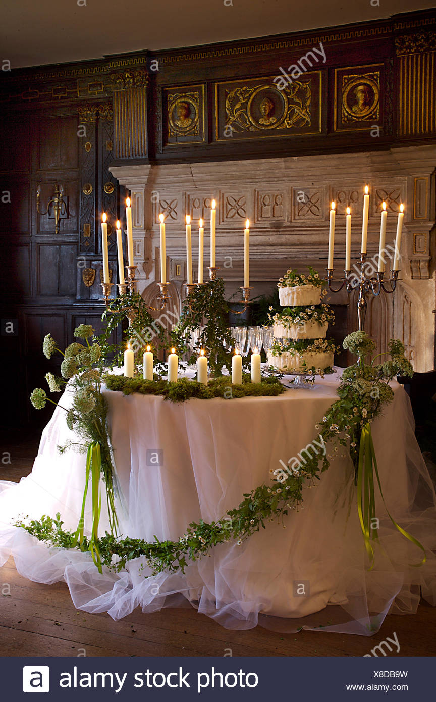 White Net Cloth With Foliage And Wild Flower Garland On Table Set