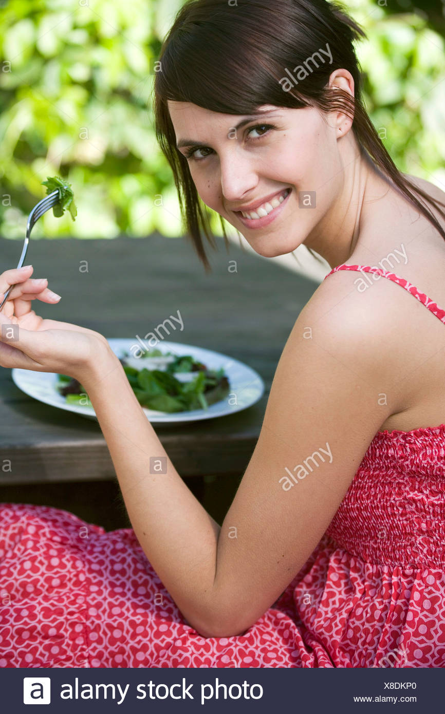Female Brunette Hair Tied Back Fringe Wearing Red And White