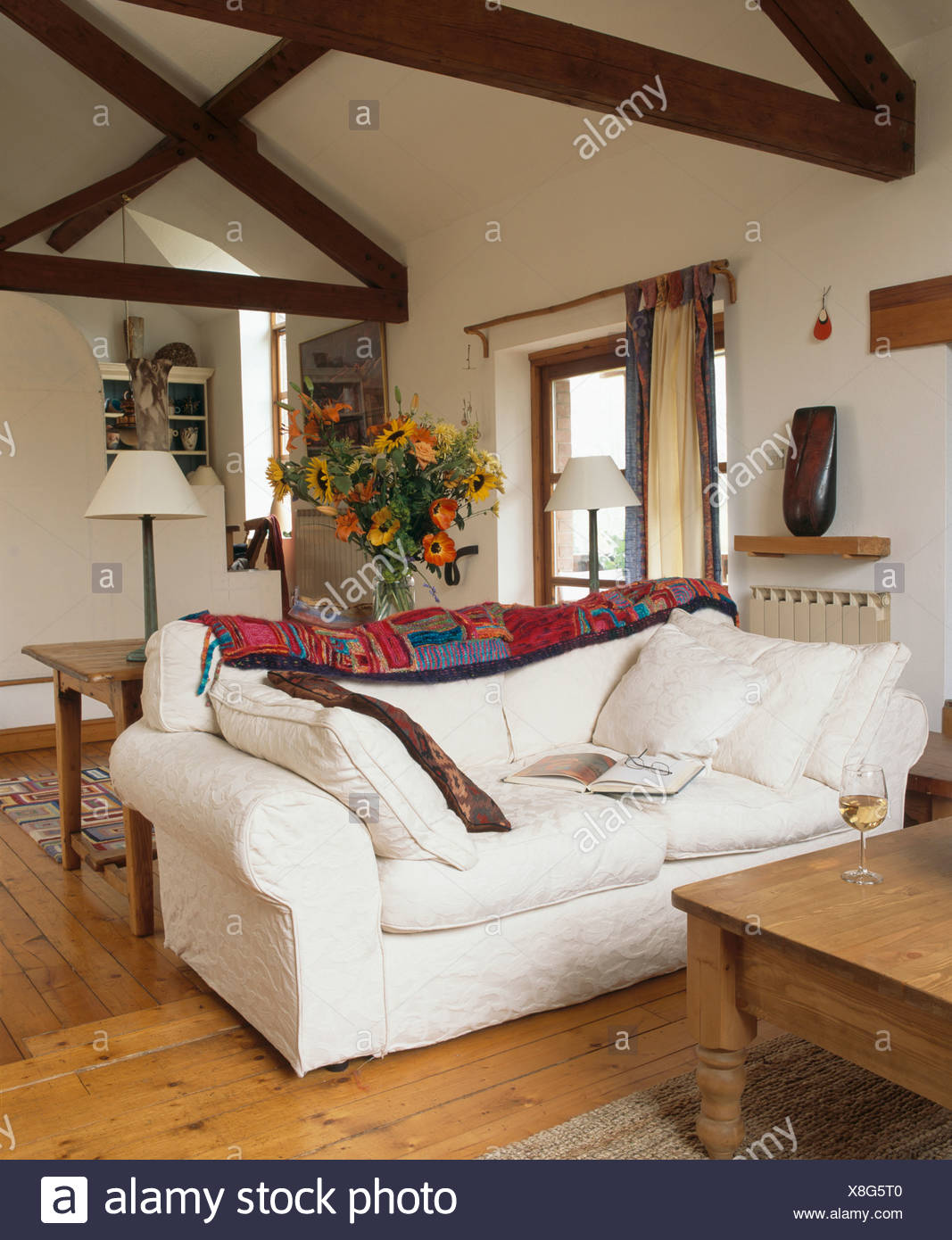 White Sofa And Pine Floorboards In Living Room In Small
