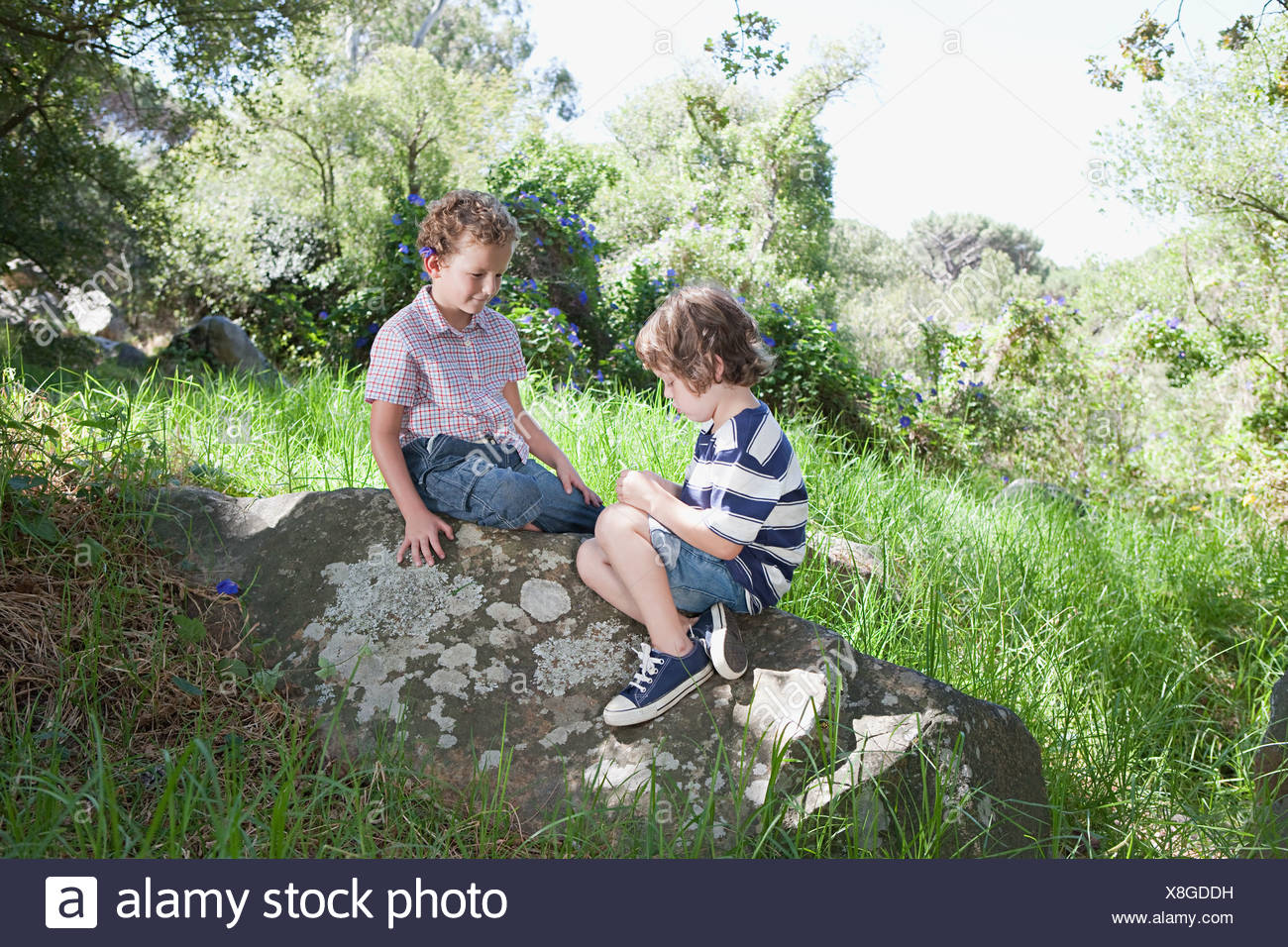 Boys Sitting On Grass High Resolution Stock Photography and Images - Alamy
