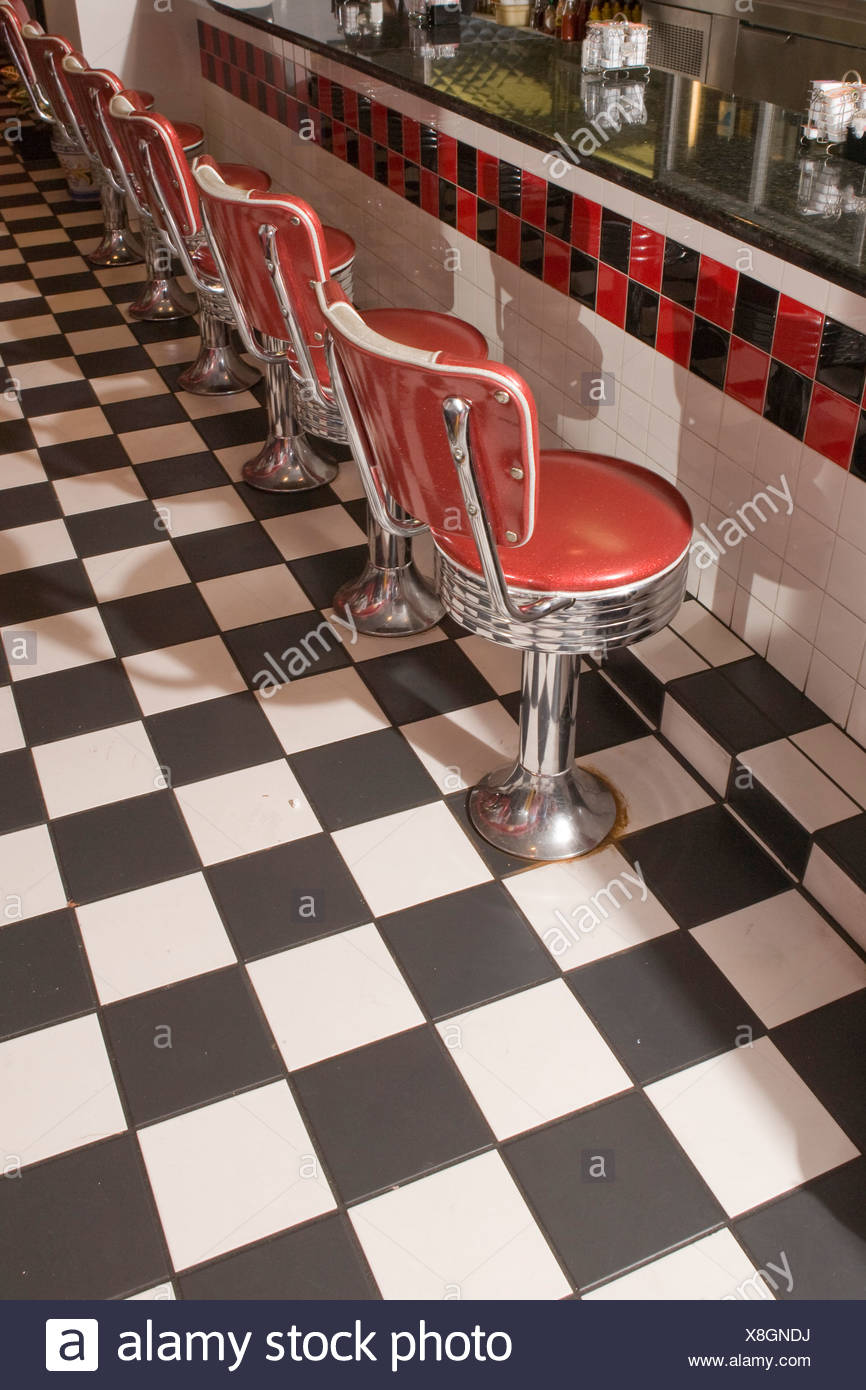 High Angle View Of Row Of 1950s Style Bar Stool Chairs In Old Fashioned Diner Stock Photo Alamy