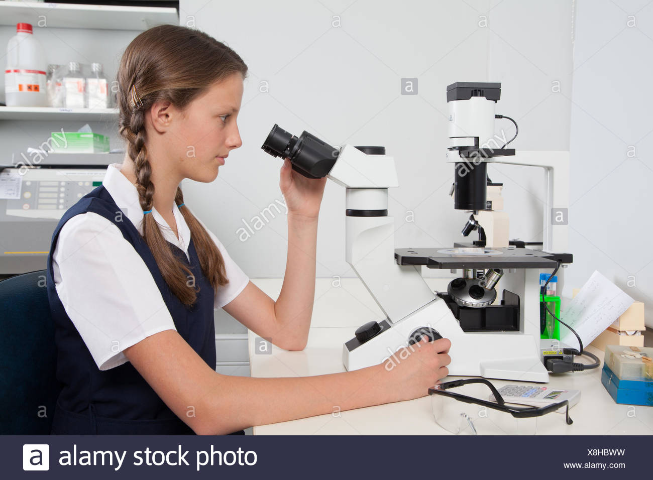 Teenage Girl Looking Through A Microscope Stock Photo Alamy