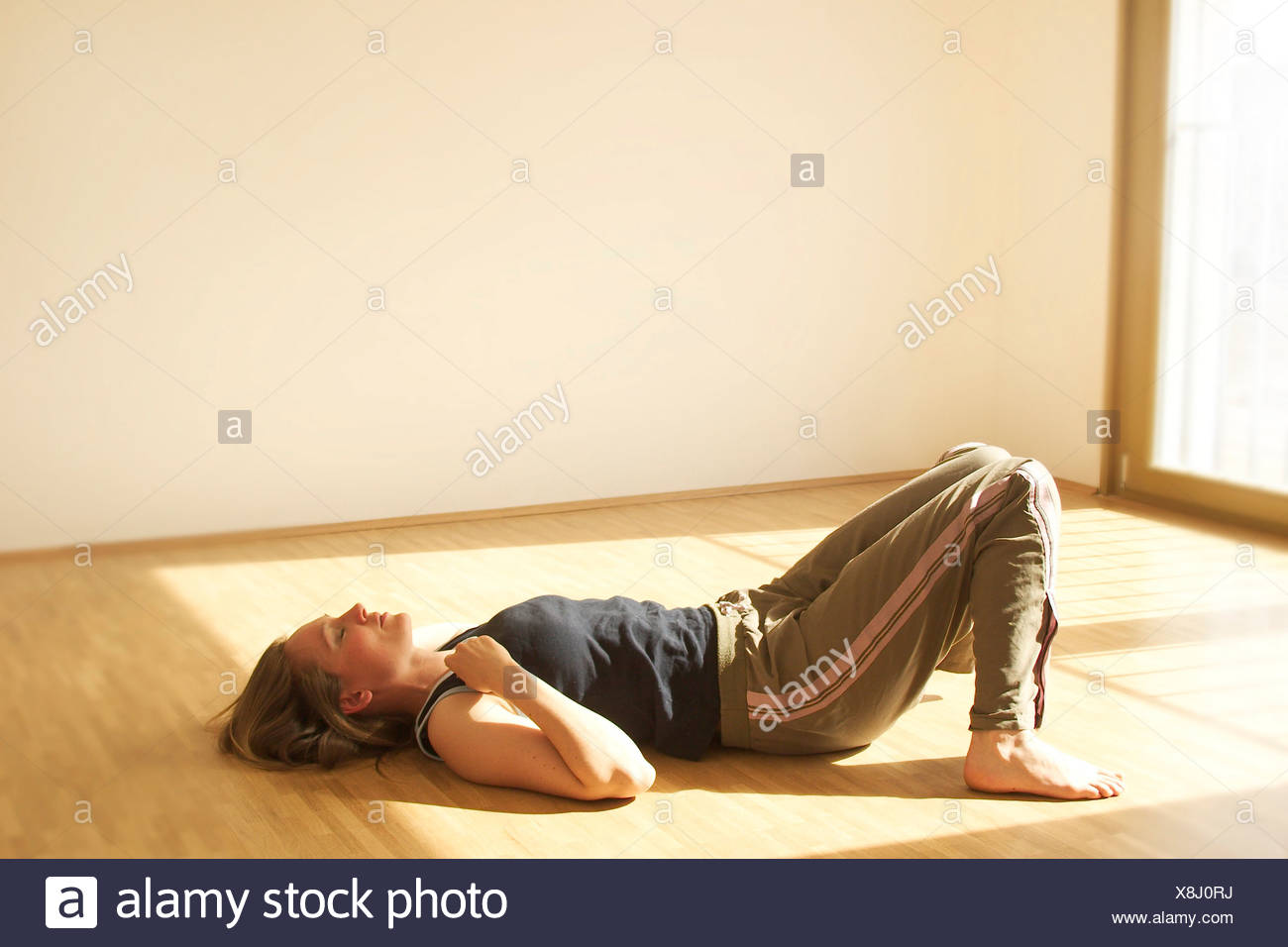 Young Woman Sleeping On Wooden Floor Stock Photo 280678934 Alamy
