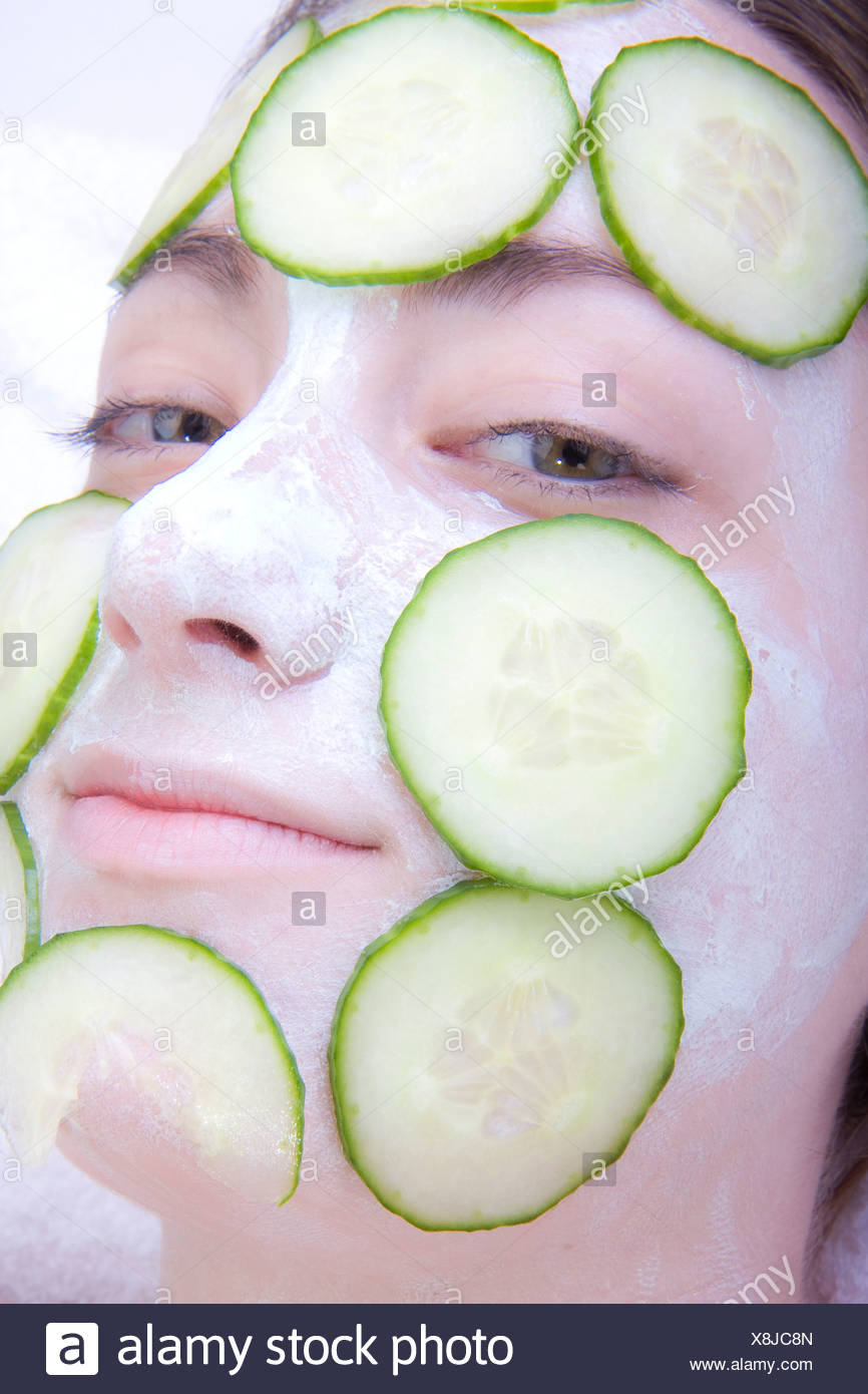 Download Young Woman With Cucumber Face Mask Stock Photo Alamy PSD Mockup Templates