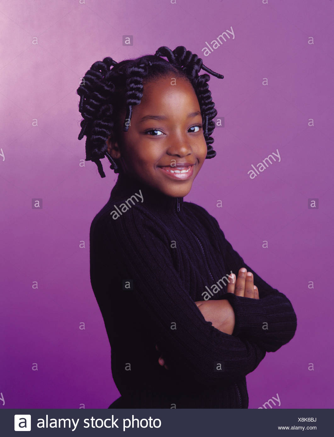 Female With Corkscrew Twists Braided Hair Wearing Black Cardigan