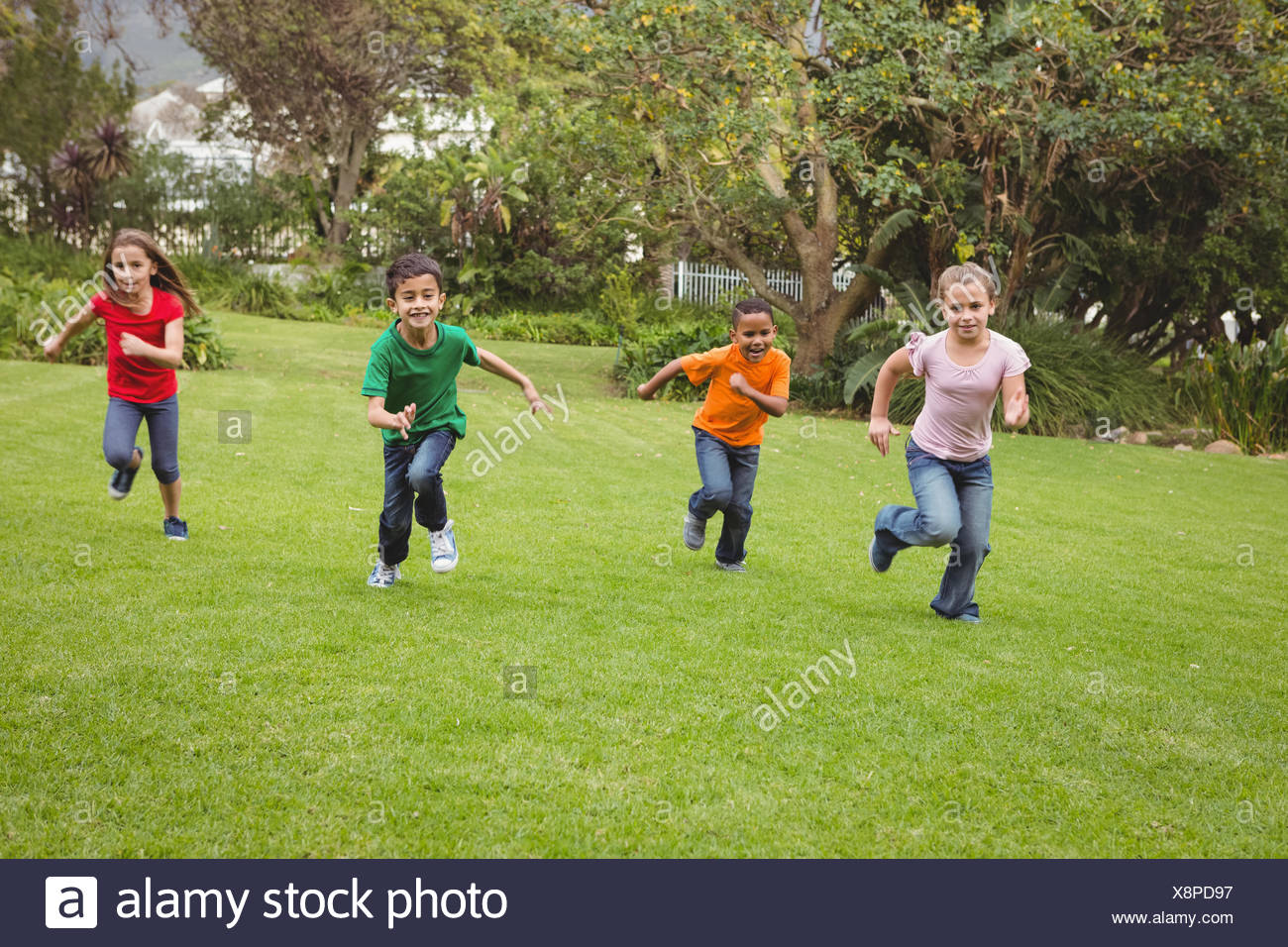 Boy Running Across Grass Stock Photos & Boy Running Across Grass Stock