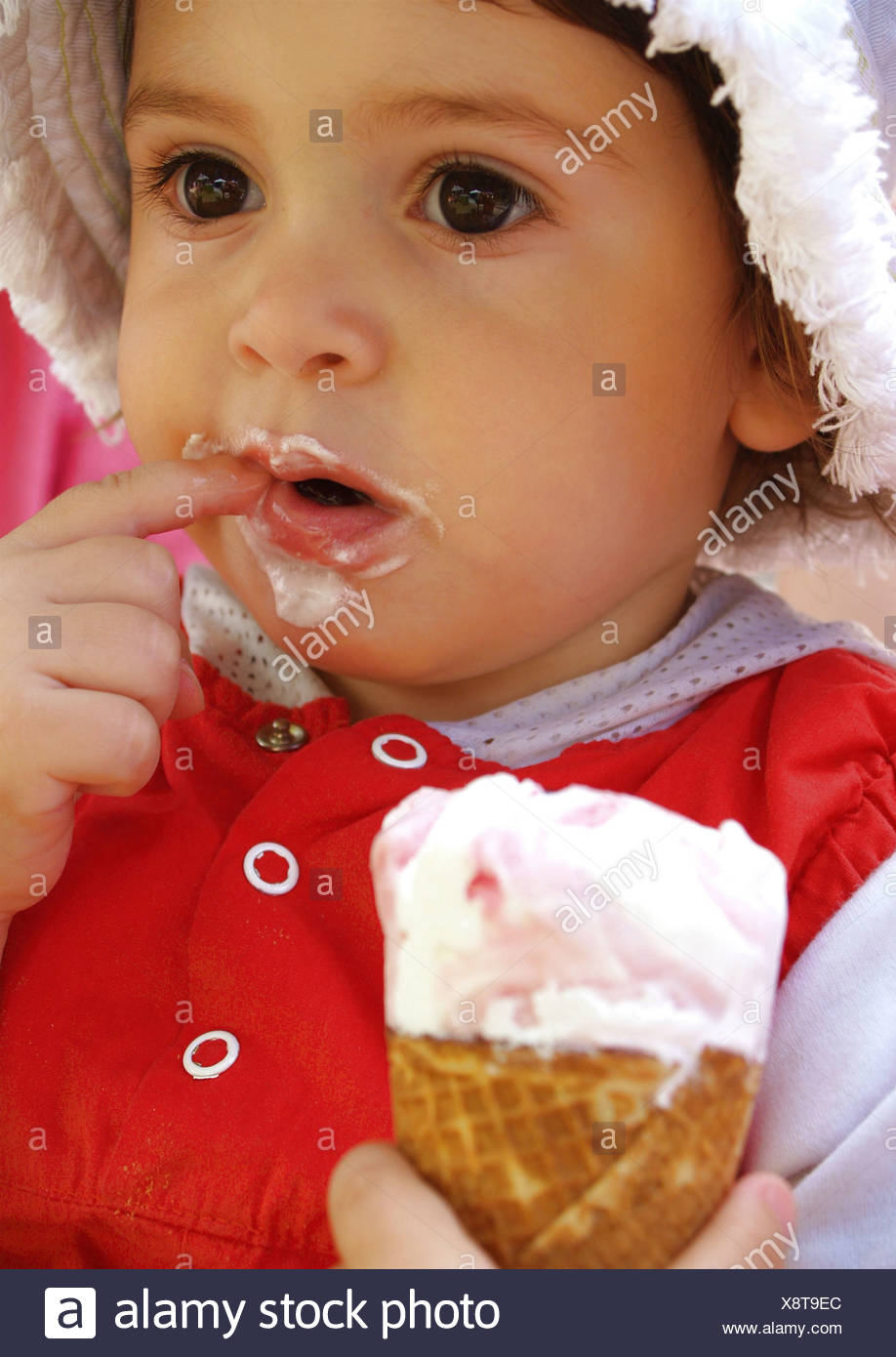 Little Girl Eating Ice Cream Stock Photo Alamy