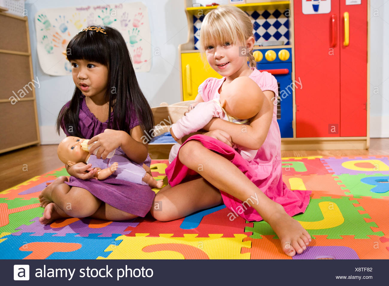kids playing with dolls