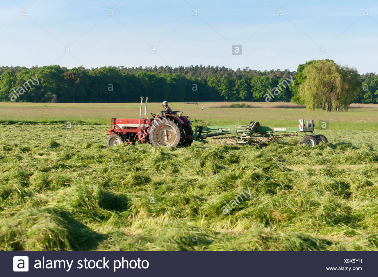 Tractor With Hay Turning Machine Farmer Working In The Fields Gotzenhain Dreieich Hesse Germany Stock Photo Alamy Tractor With Hay Turning Machine Farmer Working In The Fields Gotzenhain Dreieich Hesse Germany Stock Photo Alamy
