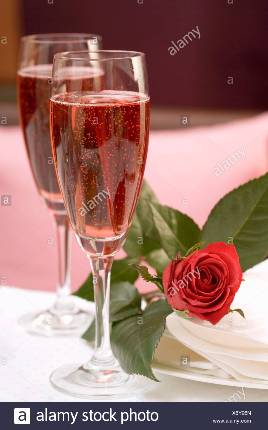 Download Two Glasses Of Pink Champagne Red Rose Beside Them Stock Photo Alamy Yellowimages Mockups