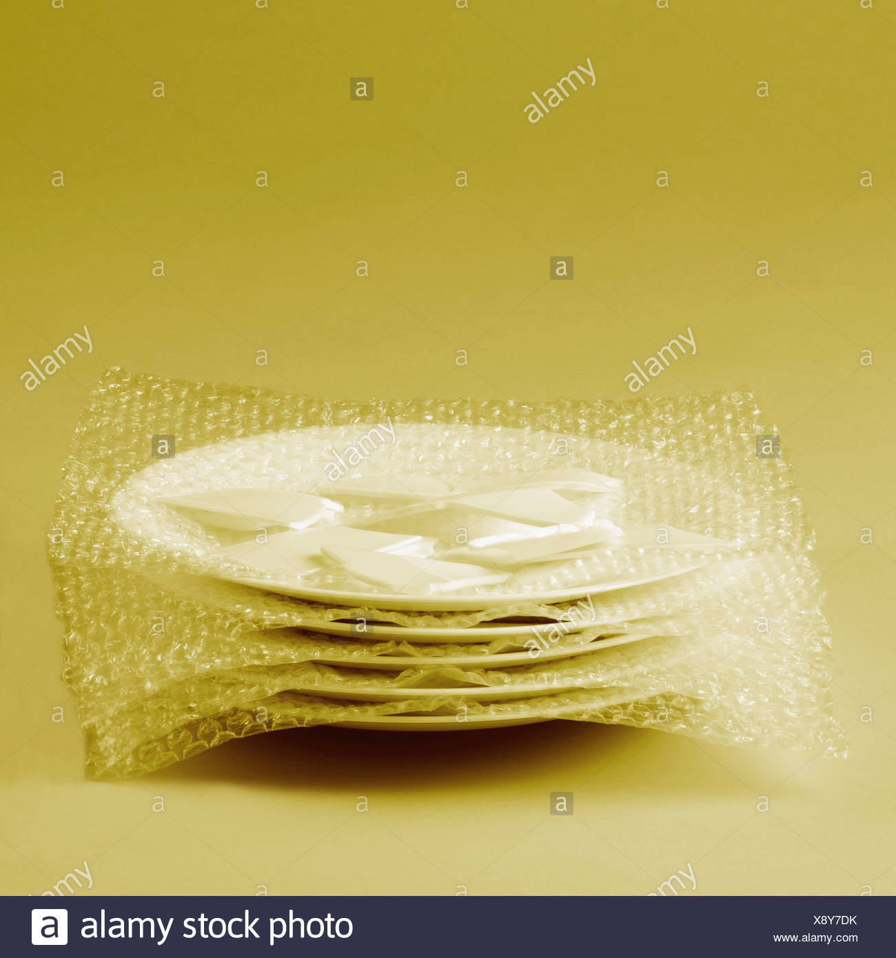 Close-up of a stack of five plates wrapped in a bubble wrap Stock ...