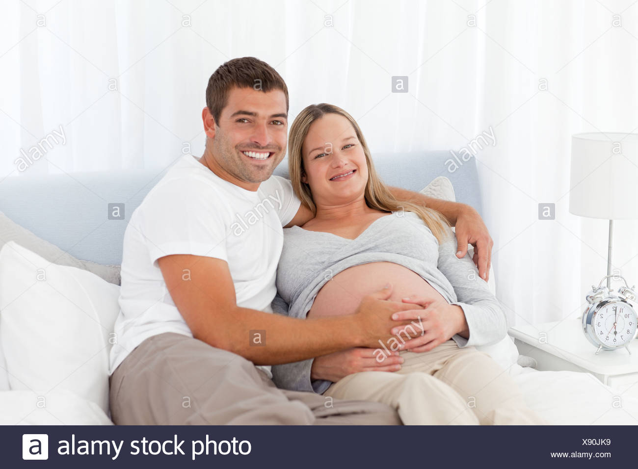 Beautiful Couple Baby On Bed Stock Photos Beautiful Couple Baby