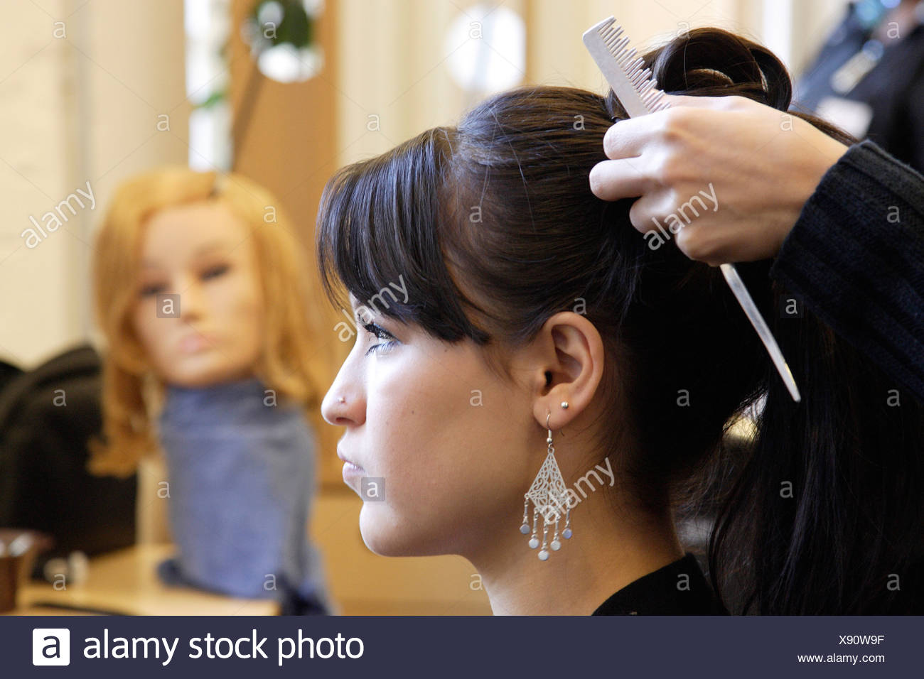 Young Hair Dresser Practising At The Sos Professional Training