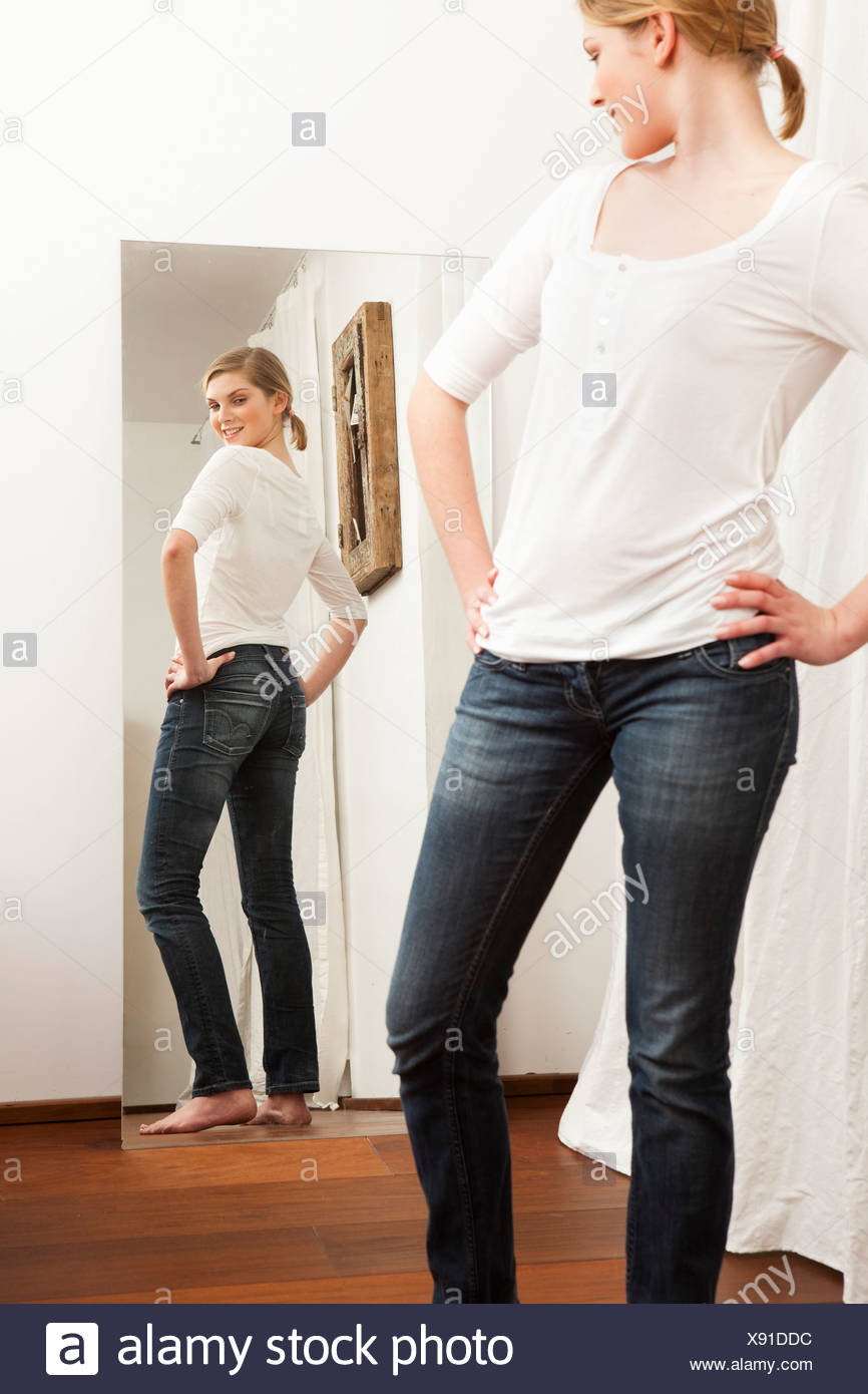 Woman Checking Body In Mirror High Resolution Stock Photography and Images  - Alamy