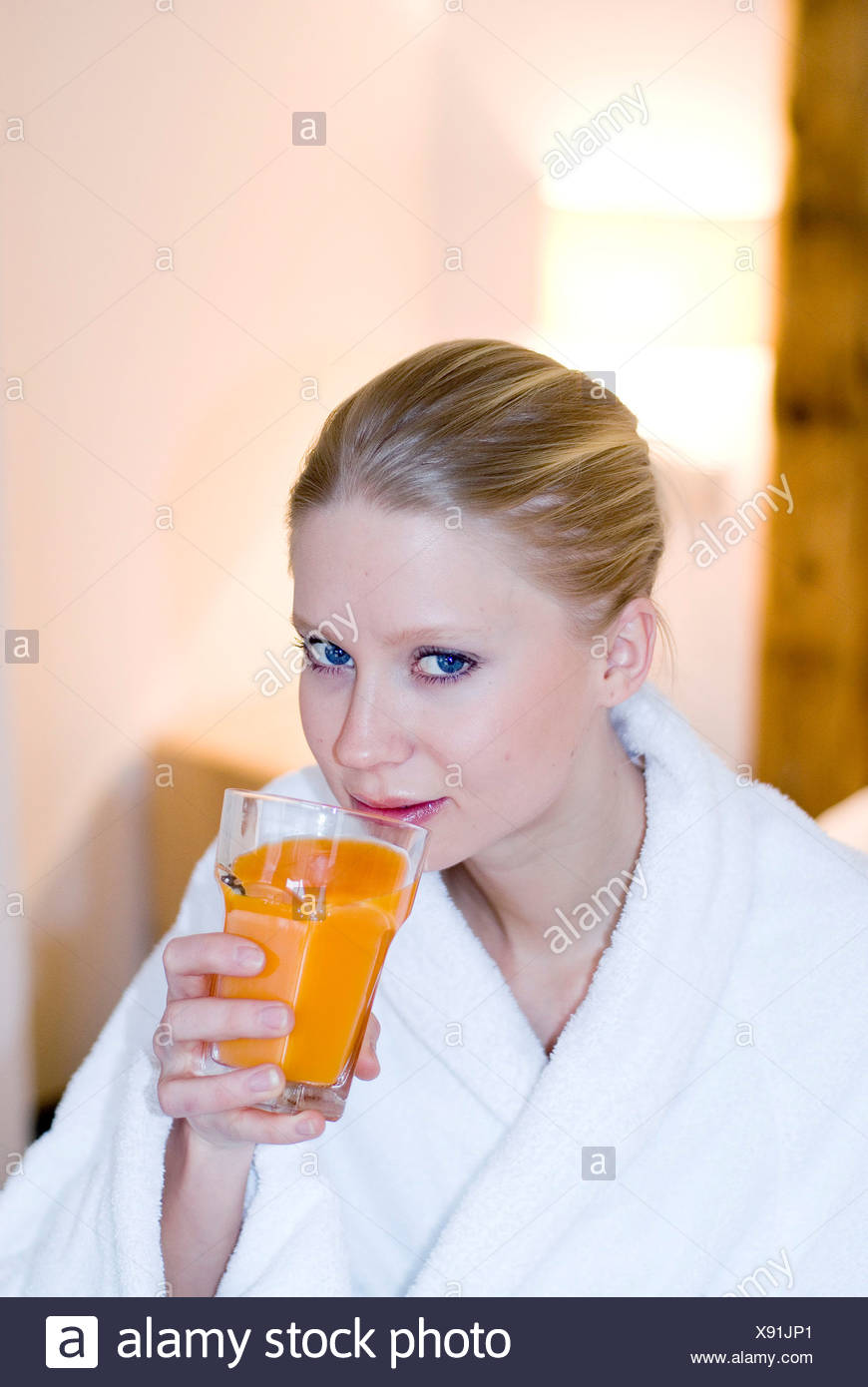 Female With Blonde Hair Wearing White Towelling Robe