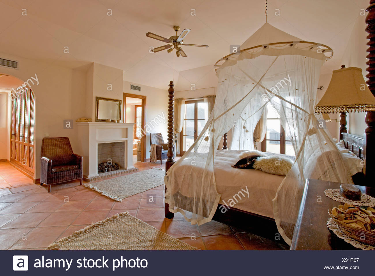 Mosquito Net Above Bed In Modern Spanish Bedroom With