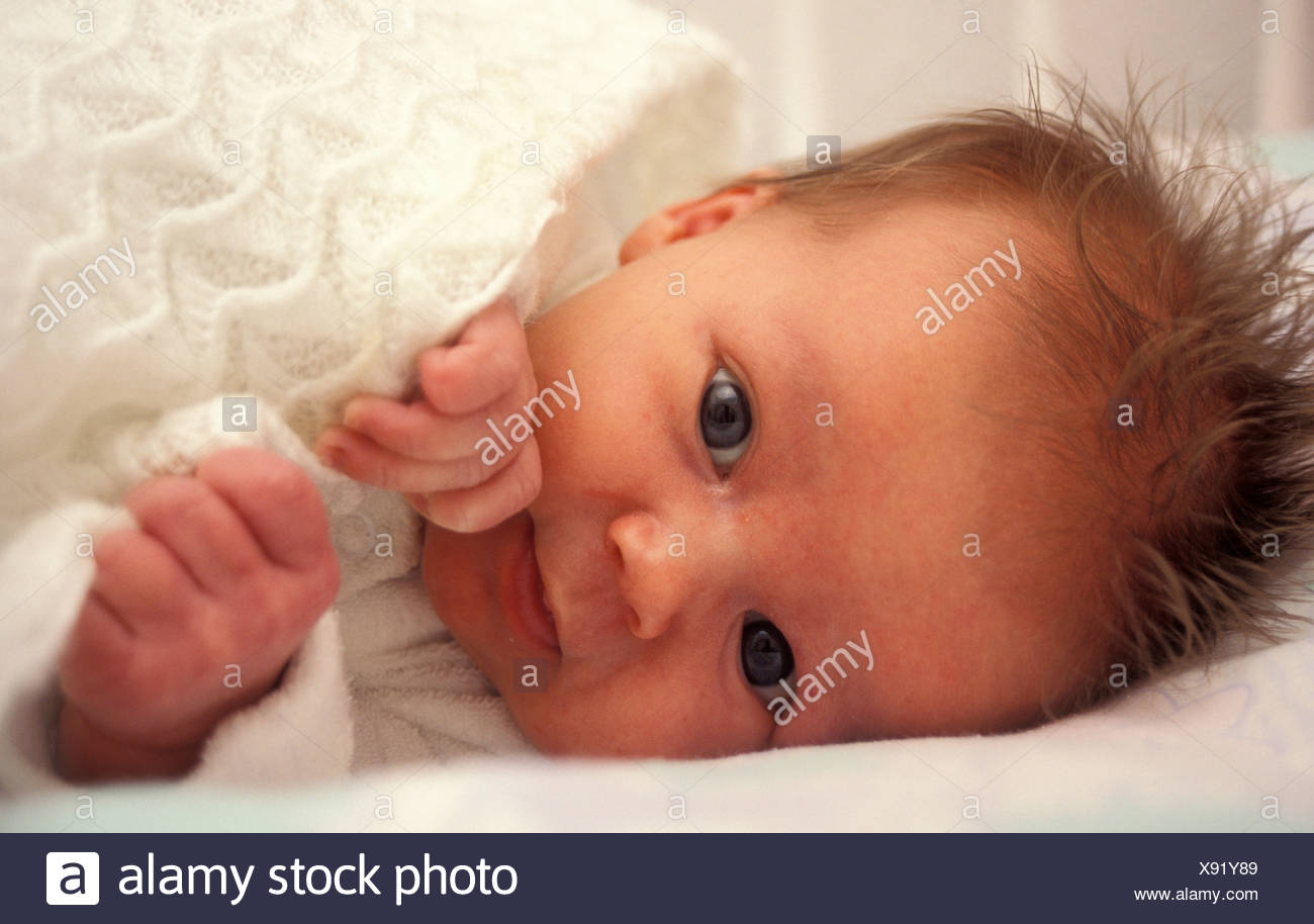 Portrait Wide Eyed Caucasian Newborn Baby Swaddled In White Blanket Stock Photo Alamy