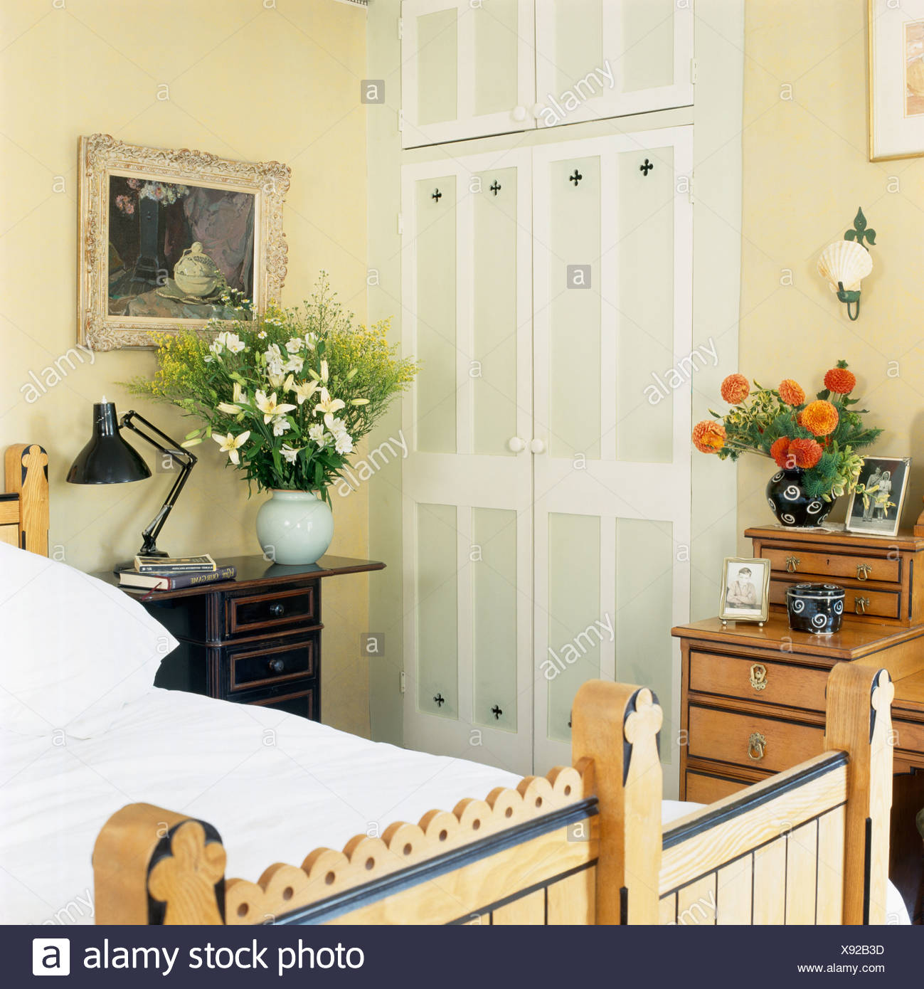 Fitted Wardrobe With Painted Doors In Cream Bedroom With Picture